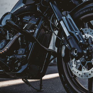 OG Black Highway Peg Crash Bar for Harley-Davidson M8 Softail with Mid Controls installed on a Harley-Davidson FXLRST Low Rider ST 2023